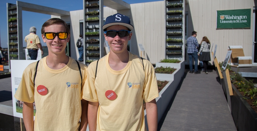 Photo of a two volunteers in yellow t-shirts.