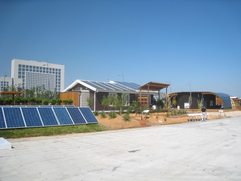 Photo of the Australia and Sweden houses. A PV array is in the foreground to the left. 