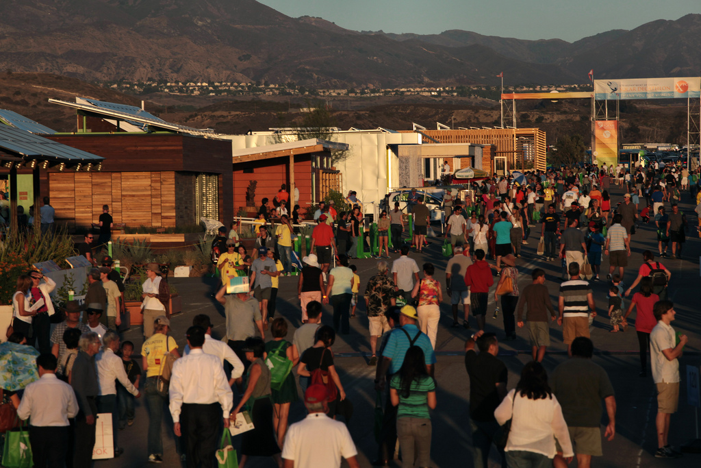 Photos of the crowd of people in the Solar Decathlon village.
