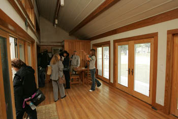 Photo of a tour being conducted inside a house.