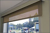 Photo of operable window shade and window.