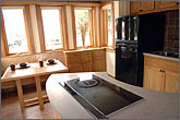 Photo of kitchen island and dining area.