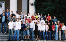 Photo of Maryland's 2005 Solar Decathlon team lined up on the front steps of a building.