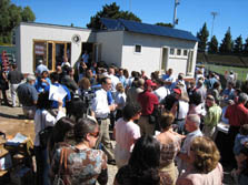 Photo of a crowd standing in front of Santa Clara's Solar Decathlon house.