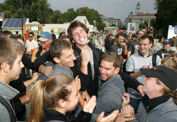 Photo of a group of students smiling, hugging, and celebrating on the National Mall.