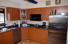 Photo of the Crowder College house kitchen.