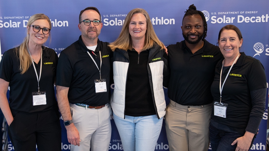 A photo of 5 Legence employees at a Solar Decathlon event.