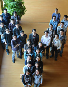 Photo of a group of people standing in the shape of a Y.