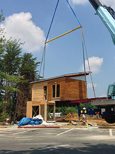 Photo of a section of WaterShed being lowered into its final location by crane.