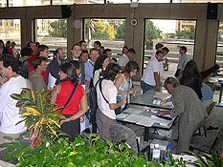 Photo of dozens of people waiting to register for the 2005 Solar Decathlon.