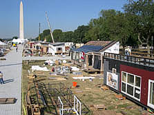 Photo of the north side of the 2005 Solar Decathlon solar village under construction.
