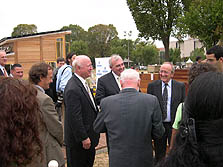 Photo of U.S. Secretary of Energy Samuel Bodman talking with members of the 2005 Solar Decathlon team from Madrid.