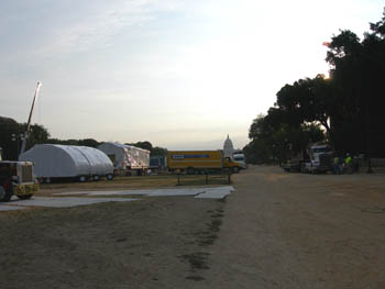 Photo of Solar Decathlon houses being assembled on the Mall with the U.S. Capitol in the background.