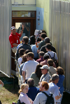Photo of a crowd outside a door.