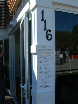 Photo of signatures on an exterior wall.