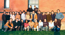 Photo of Cornell's 2005 Solar Decathlon team posing in front of a building.