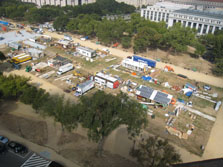 An aerial view of the east end of the Solar Decathlon includes nine partially completed houses.