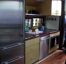 Photo showing a kitchen, including a refrigerator, sink, oven, and dishwasher.