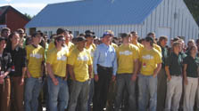 Photo of a group of people dressed in matching T-shirts. Richard King stands in the middle.