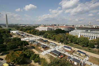 Aerial photo of the Solar Decathlon solar village on the National Mall. The Washington Monument is visible in the distance.