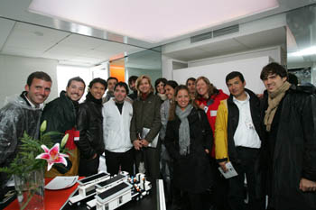 Photo of Princess Cristina with students from Team Spain standing inside the Team Spain house.