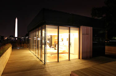 Photo of the exterior of the Team Ontario/BC Solar Decathlon 2009 house at night.