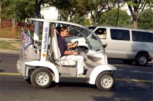 Photo of students driving electric car.