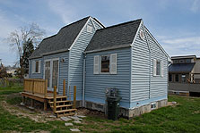 Photo of the University of Missouri-Rolla's 2002 house pictured from the rear with its 2005 house visible in the background.