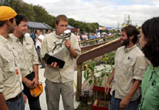 Photo of student from the University of Colorado kissing the trophy the university earned by winning the 2005 Solar Decathlon.