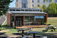 Photo of Pittsburgh Synergy's solar house in its permanent location on Carnegie Mellon's campus.