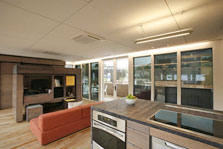 Photo of Curio.House's interior kitchen and living room area at the U.S. Department of Energy Solar Decathlon 2009.