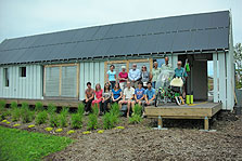 Photo of students, faculty, and visitors on Gable Home's porch.