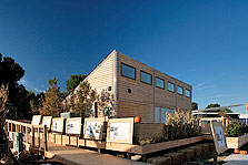 Photo of Interlock House and its exhibit signage at Solar Decathlon 2009.